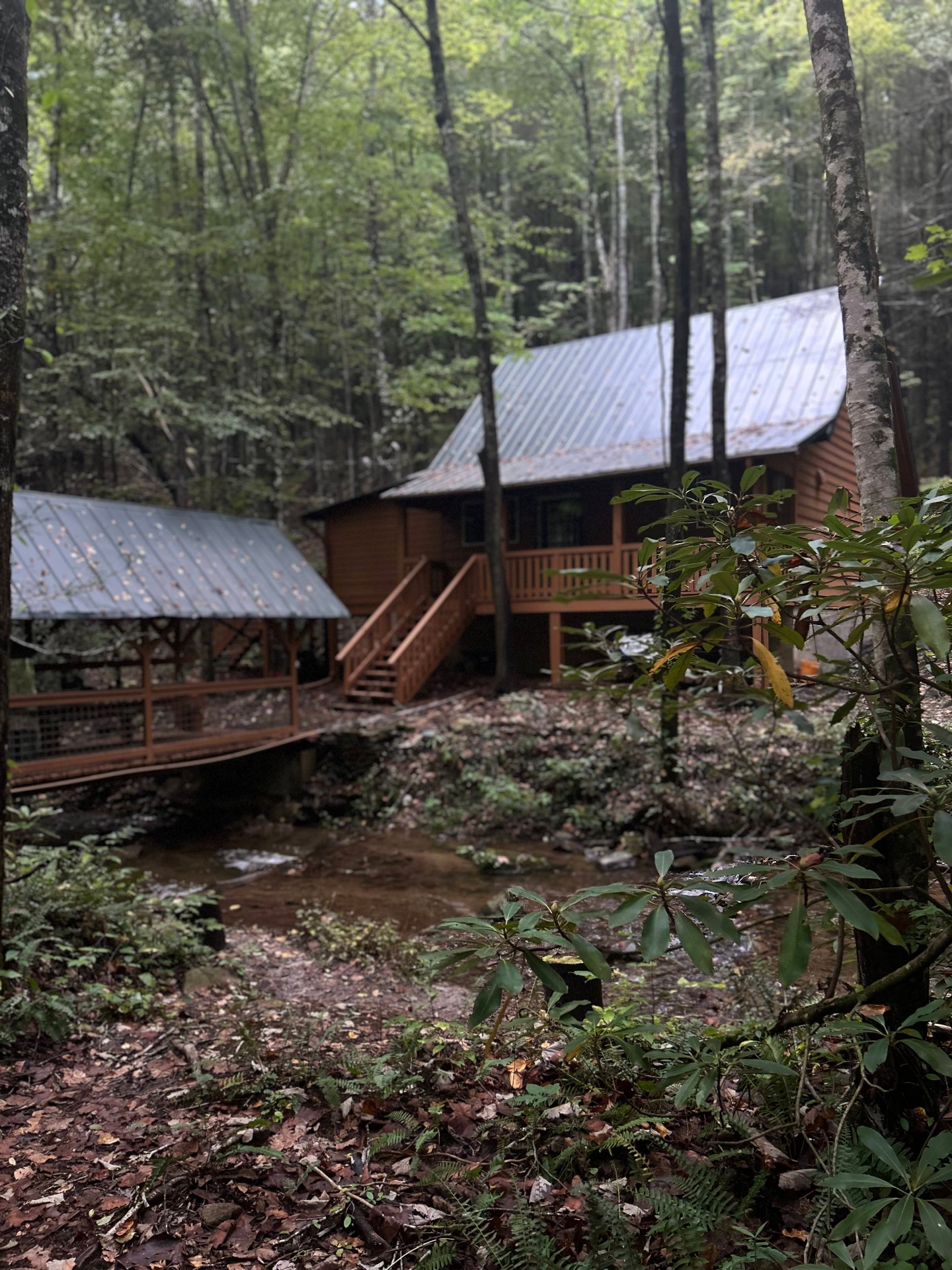 Sherpa Camp cabin and covered bridge crossing a creek in the Cohutta Wilderness.